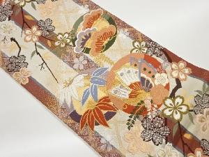 丸文に松竹梅・蝶・桜模様織出し全通袋帯